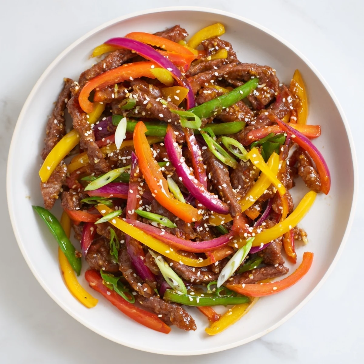 Sizzling strips of marinated beef and colorful crisp vegetables in a spicy sauce, perfect Spicy Beef Stir Fry with Vegetables served steaming hot.