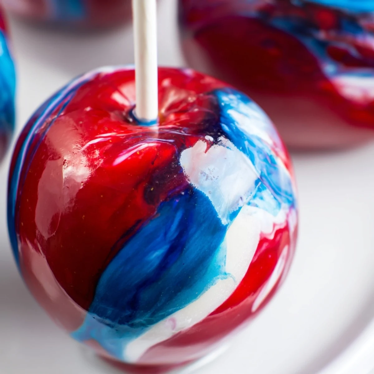 Serve these beautiful Marbled Effect Candy Apples at your next festive autumn party or Halloween event.