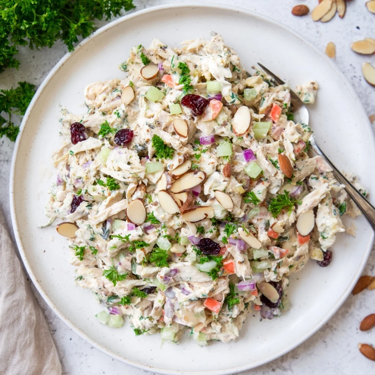 Creamy Greek yogurt rotisserie chicken salad with crisp celery, red bell pepper, and fresh parsley