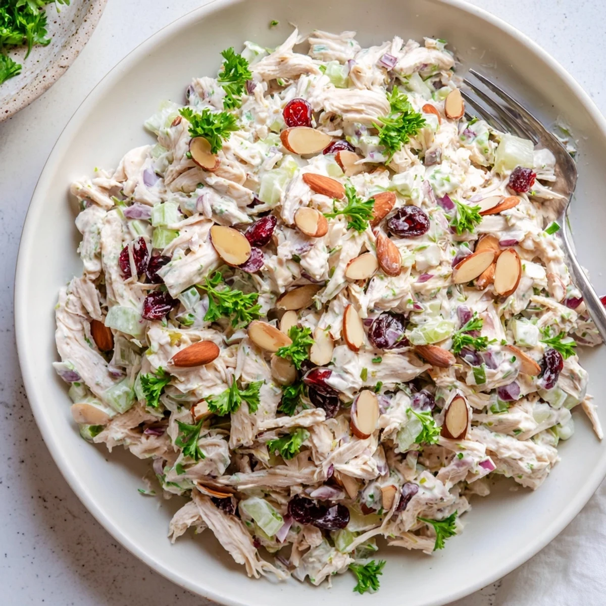 Light and protein-packed Greek yogurt rotisserie chicken salad served on a bed of fresh greens