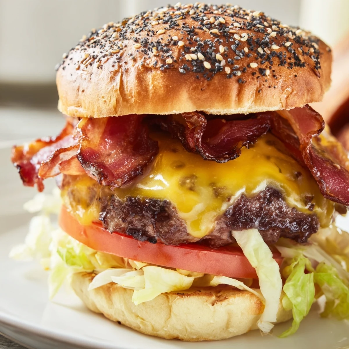 Juicy homemade Crack Burgers stacked with crispy bacon, melted cheddar and tangy ranch-mayo sauce on toasted brioche buns