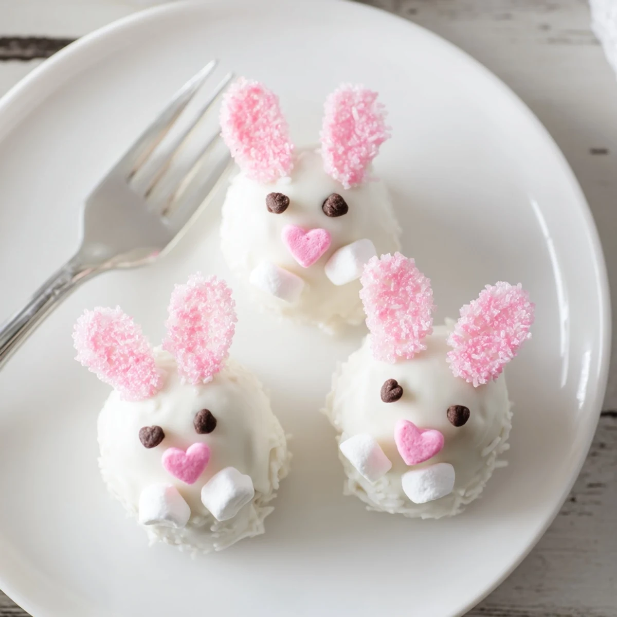 No-bake Bunny Oreo balls featuring cute bunny faces with pastel pink ears and fluffy white tails