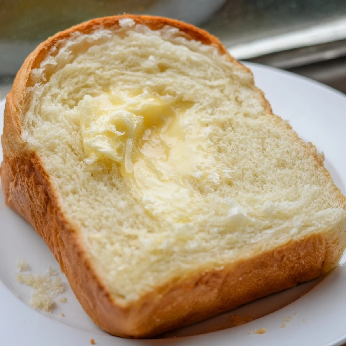 Sliced homemade Amish white bread revealing fluffy white crumb ideal for toasting and sandwiches