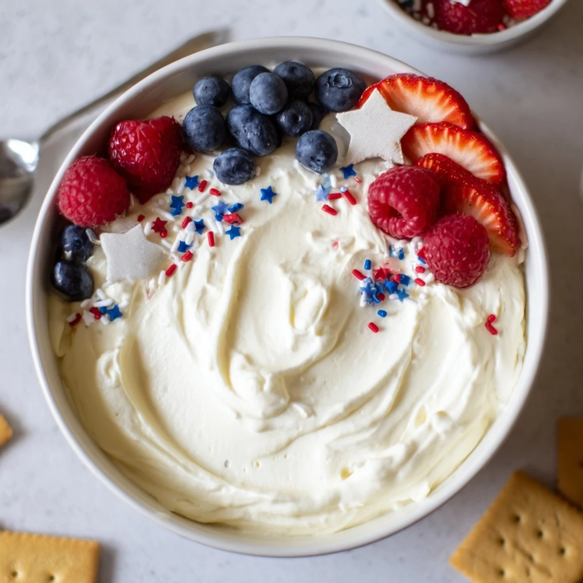 How To Make Star Spangled Cheesecake Dip, creamy and topped with berries.