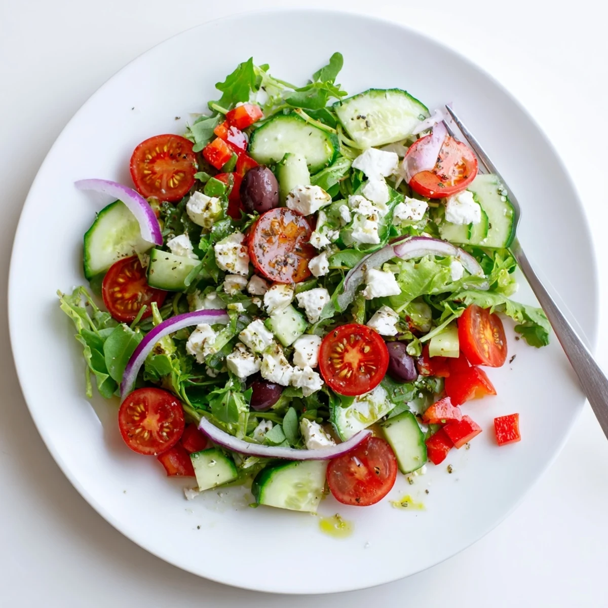 Fresh Salad Recipe layered with peppery arugula, tangy feta, crunchy bell pepper.