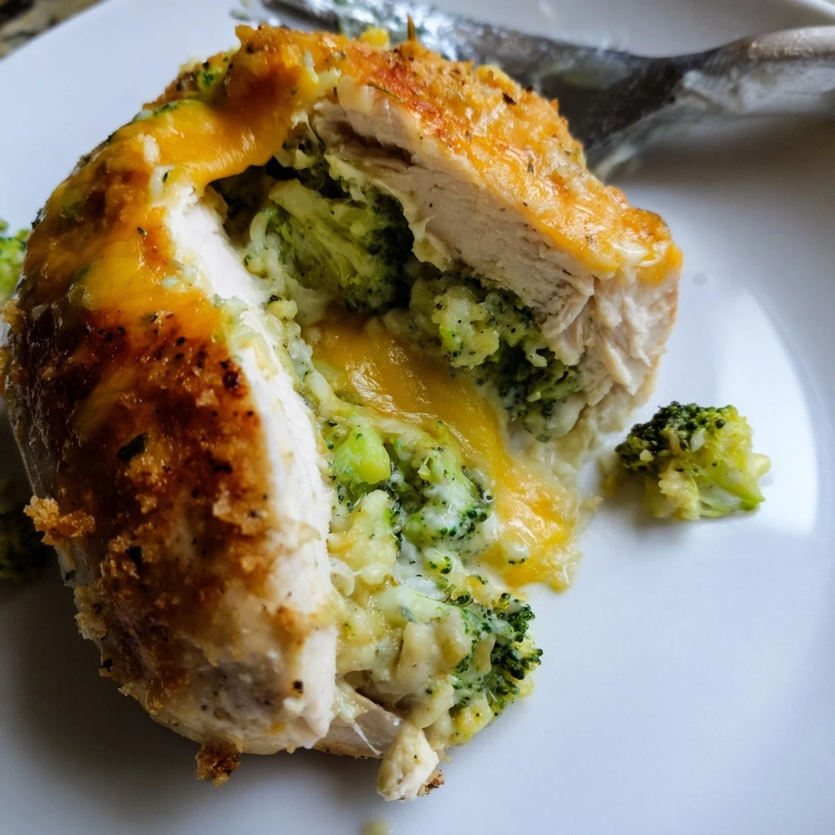 Golden baked Broccoli Cheese Stuffed Chicken Breast with bubbling cheddar-streaked pocket