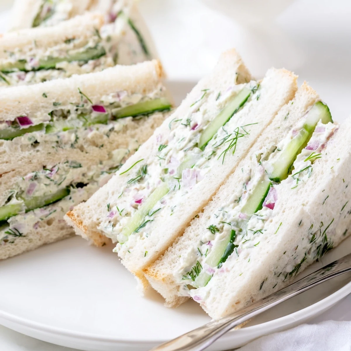Light lunch cucumber salad sandwiches with soft bread layers and refreshing cucumber filling